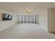 Large main bedroom with wall-to-wall carpet and multiple windows at 5315 Hopewell Manor Dr, Cumming, GA 30028