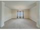 Main bedroom with high ceilings, carpet, and large windows at 5315 Hopewell Manor Dr, Cumming, GA 30028