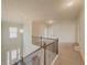 Upstairs hallway overlooks the entryway at 5315 Hopewell Manor Dr, Cumming, GA 30028