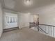 Spacious upstairs hallway with access to bedrooms and bathroom at 5315 Hopewell Manor Dr, Cumming, GA 30028