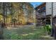 Backyard with deck, screened porch, and wooded area at 1054 Sunny Field Ln, Lawrenceville, GA 30043