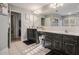 Bathroom with double vanity, large mirror, and separate shower at 1054 Sunny Field Ln, Lawrenceville, GA 30043