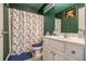 Bathroom with shower/tub combo and patterned shower curtain at 1054 Sunny Field Ln, Lawrenceville, GA 30043