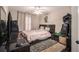 Bedroom with a bed, dresser, and carpet flooring at 1054 Sunny Field Ln, Lawrenceville, GA 30043