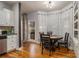 Kitchen breakfast nook with a round table and chairs near a door to a deck at 1054 Sunny Field Ln, Lawrenceville, GA 30043
