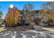 Two story house with fall leaves and a driveway at 1054 Sunny Field Ln, Lawrenceville, GA 30043