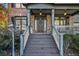 Brick house with a front porch, stairs, and lamp post at 1054 Sunny Field Ln, Lawrenceville, GA 30043