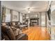 Spacious Gathering room with hardwood floors, fireplace and sectional sofa at 1054 Sunny Field Ln, Lawrenceville, GA 30043
