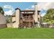Two-story house with a large deck and fenced backyard at 1054 Sunny Field Ln, Lawrenceville, GA 30043