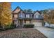 Two-story brick home with a covered porch and attached garage at 1054 Sunny Field Ln, Lawrenceville, GA 30043
