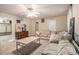 Living Room with beige sofas and a metal coffee table at 1054 Sunny Field Ln, Lawrenceville, GA 30043