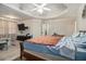 Spacious main bedroom with sitting area, large bed, and trey ceiling at 1054 Sunny Field Ln, Lawrenceville, GA 30043