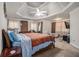 Main bedroom with a king-size bed and sitting area at 1054 Sunny Field Ln, Lawrenceville, GA 30043