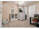 Home office with built-in shelving and a standing desk at 1054 Sunny Field Ln, Lawrenceville, GA 30043
