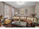 Sitting room with sectional sofa and large window at 1054 Sunny Field Ln, Lawrenceville, GA 30043