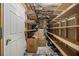 Unfinished basement with shelving for ample storage at 1054 Sunny Field Ln, Lawrenceville, GA 30043