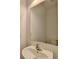 Simple bathroom with white sink, vanity, and large mirror at 1124 Lossie Ln, Grayson, GA 30017