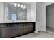 Bathroom with double vanity, mirror, and access to closet at 1124 Lossie Ln, Grayson, GA 30017
