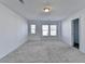 Spacious bedroom with grey carpet, neutral walls, and ample natural light at 1124 Lossie Ln, Grayson, GA 30017