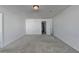 Spacious bedroom with grey carpet, neutral walls, and ample natural light at 1124 Lossie Ln, Grayson, GA 30017