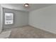 Bright bedroom with carpeted floor and window at 1124 Lossie Ln, Grayson, GA 30017