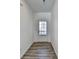 Bright foyer with wood-look floors and an interior door leading to the living space at 1124 Lossie Ln, Grayson, GA 30017