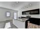 Modern kitchen with granite countertops, stainless steel appliances, and dark cabinetry at 1124 Lossie Ln, Grayson, GA 30017