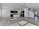 Open concept kitchen and living area with modern finishes and island at 1124 Lossie Ln, Grayson, GA 30017