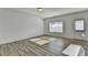 Spacious living room with wood-look floors and abundant natural light at 1124 Lossie Ln, Grayson, GA 30017