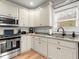 Modern kitchen with granite countertops and ample cabinet space at 5165 Hyde Way, Cumming, GA 30040