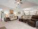 Spacious living room features a vaulted ceiling, neutral color palette, and ample natural light at 5165 Hyde Way, Cumming, GA 30040