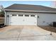 Exterior view of two-car garage with white doors at 85 Hammock Dr, Covington, GA 30016