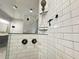 Modern shower with double shower heads and glass enclosure at 85 Hammock Dr, Covington, GA 30016