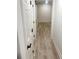 Basement hallway with light gray vinyl plank flooring and white doors at 1563 Bailey Farms Dr, Lawrenceville, GA 30043