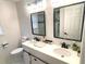Updated bathroom with double vanity, modern fixtures, and a frameless shower at 1563 Bailey Farms Dr, Lawrenceville, GA 30043