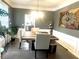 Elegant dining room with hardwood floors and a large, decorative wall piece at 1563 Bailey Farms Dr, Lawrenceville, GA 30043