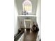 Elegant two-story entryway with chandelier and hardwood floors at 1563 Bailey Farms Dr, Lawrenceville, GA 30043