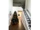 Bright entryway with hardwood floors, featuring a grand staircase and Christmas tree at 1563 Bailey Farms Dr, Lawrenceville, GA 30043