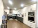 Modern kitchen with stainless steel appliances and two-toned cabinetry at 1563 Bailey Farms Dr, Lawrenceville, GA 30043