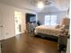 Large main bedroom with hardwood floors and ensuite bathroom at 1563 Bailey Farms Dr, Lawrenceville, GA 30043