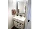 Modern powder room with white vanity and stylish tile at 1563 Bailey Farms Dr, Lawrenceville, GA 30043