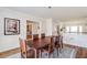 Spacious dining room with hardwood floors and view of kitchen at 5225 Bannergate Dr, Alpharetta, GA 30022