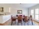 Bright dining room with hardwood floors and view of kitchen at 5225 Bannergate Dr, Alpharetta, GA 30022