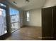 Bedroom with hardwood floors, large window, and private balcony access at 1158 Reynolds Square Ln, Atlanta, GA 30307