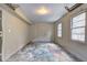 Unfinished basement with concrete floor and two windows at 631 Church Nw St, Atlanta, GA 30318