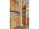 Kitchen featuring wood cabinets and a pull-out pantry at 631 Church Nw St, Atlanta, GA 30318