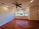 Bright living room featuring hardwood floors and a ceiling fan at 5494 Alder Dr, Forest Park, GA 30297