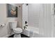 Clean bathroom with white subway tile, bathtub, and shower at 176 Rhodesia Se Ave, Atlanta, GA 30315