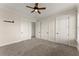 Spacious bedroom with neutral carpeting, ceiling fan, and ample closet space at 351 Washington Ne Ave # 302, Marietta, GA 30060