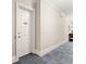 Apartment entry hallway with neutral carpeting and white doors at 351 Washington Ne Ave # 302, Marietta, GA 30060